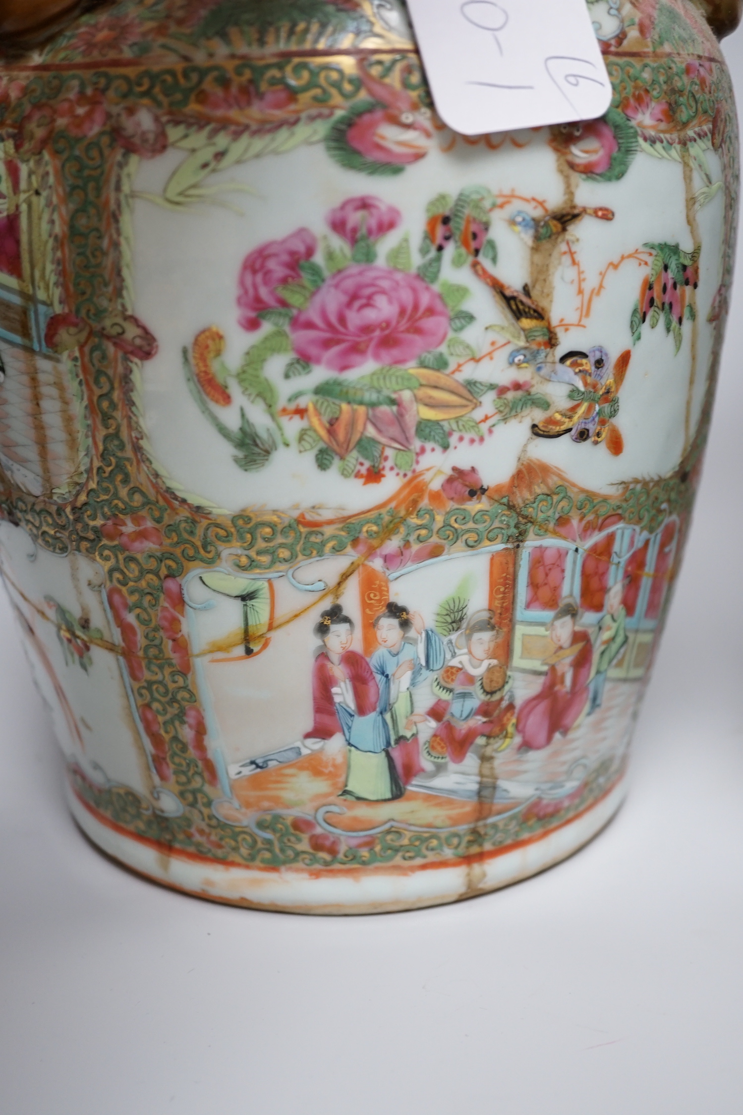 A pair of Chinese Canton decorated famille rose enamelled vases, 36cm high, an early 20th century Chinese blue and white baluster vase, 25cm (a.f.), a 19th century Chinese blue and white gu shaped vase, 37.5cm (a.f.), a